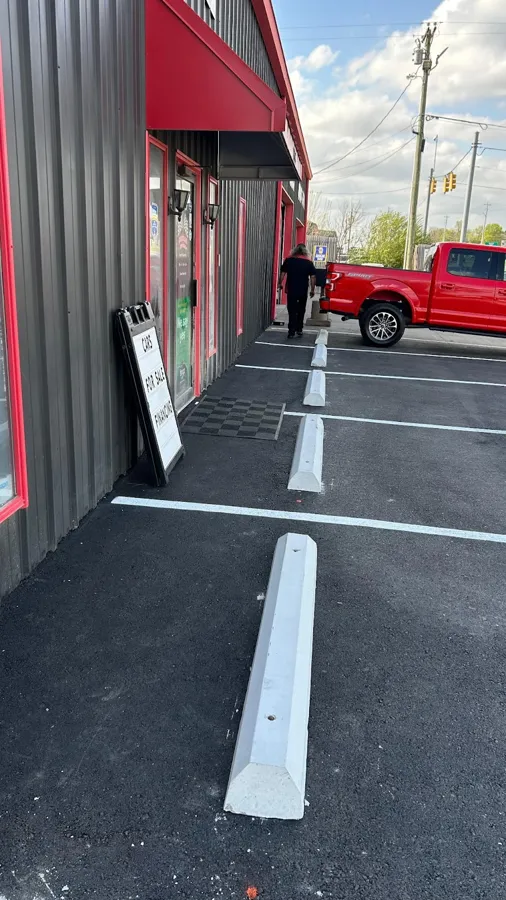 Parking lot curb stops and striping, SC Concrete LLC