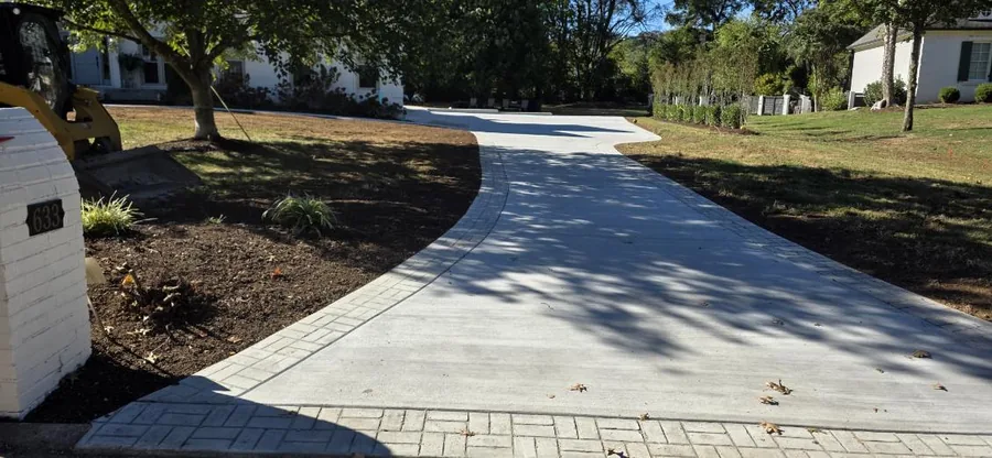 Curved concrete driveway with a stamped paver-look border, SC Concrete LLC