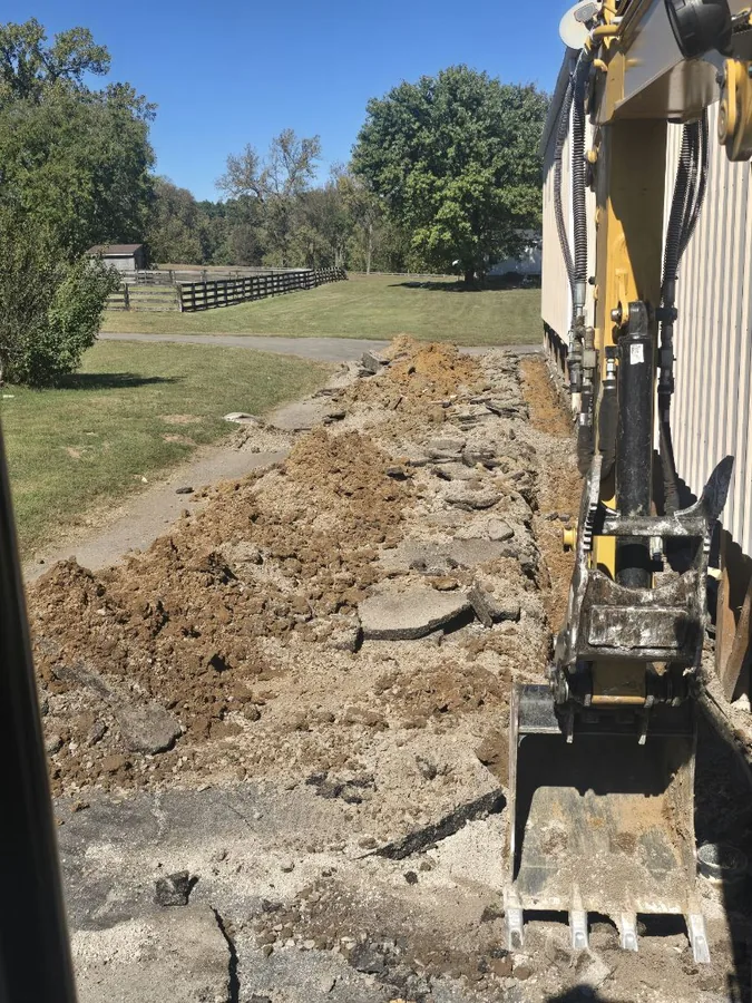 Tearing out an old slab with a mini excavator, SC Concrete LLC